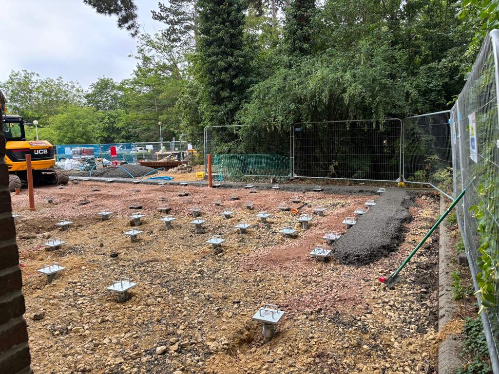 Grid of galvanised pile caps ready for slab construction