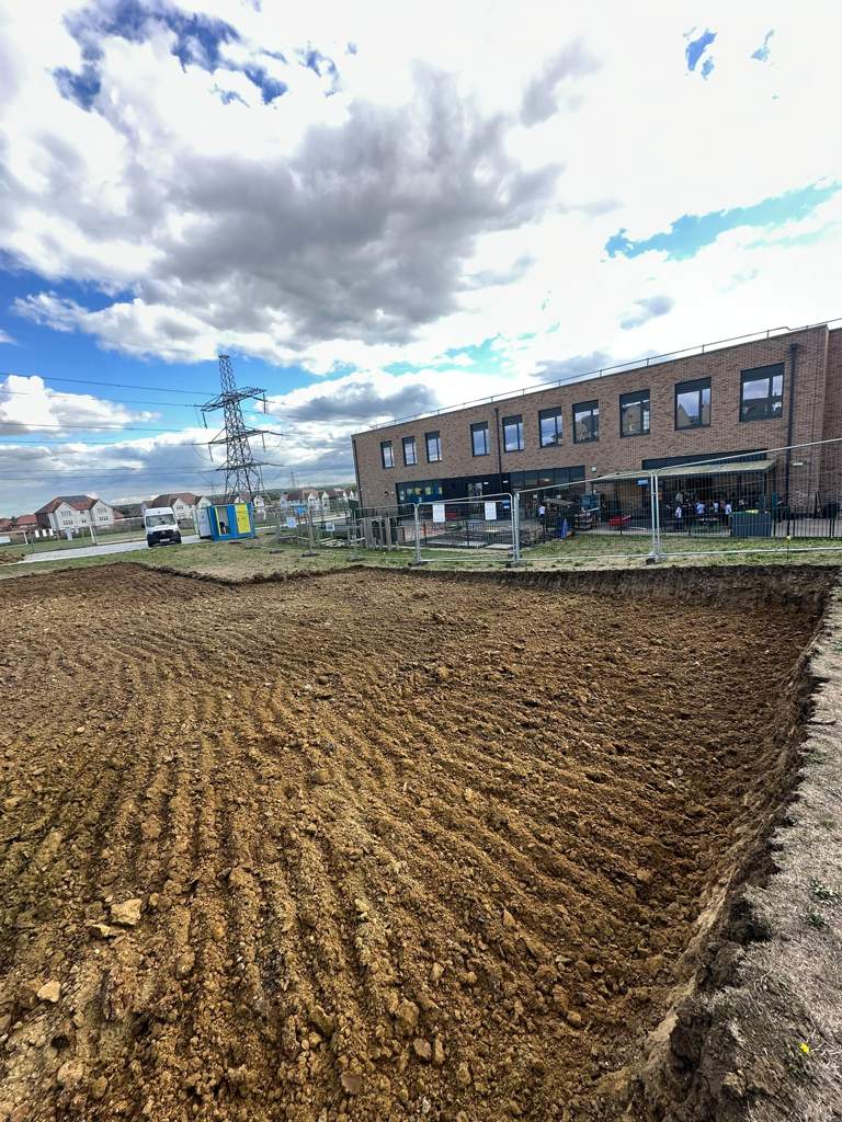 Excavator and dumper stripping the site to formation Cambridge