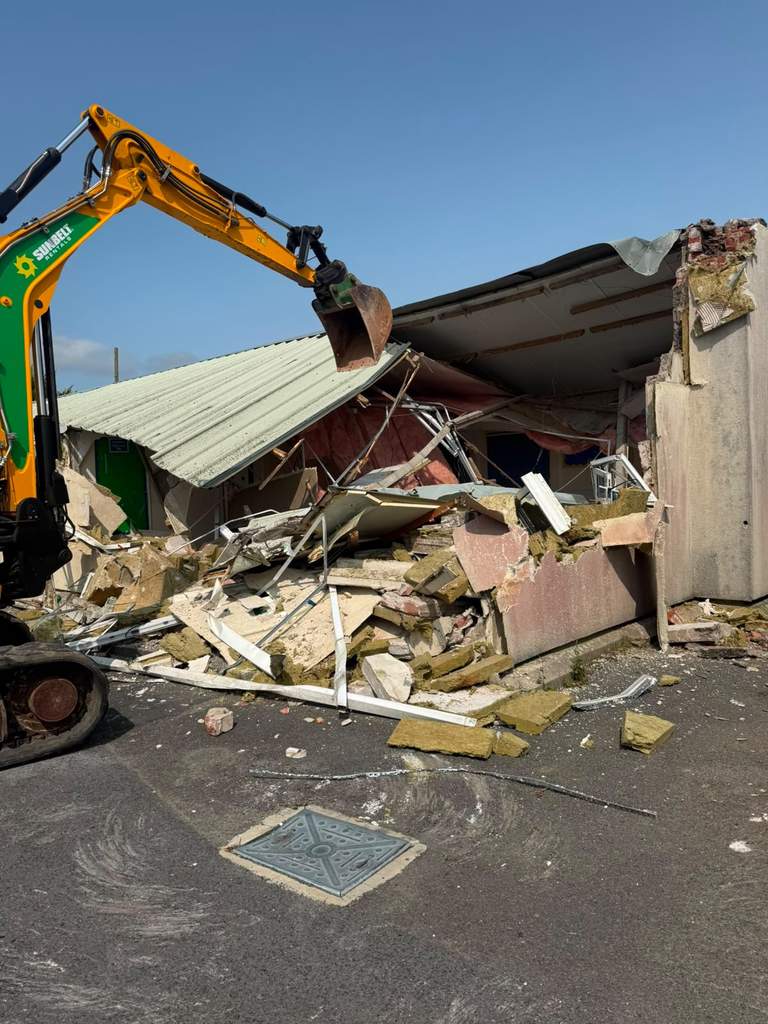 Excavator demolishing former school building in Pembrokeshire South Wales — M.Smithson LTD