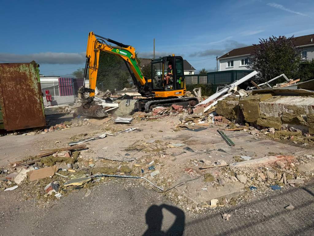 JCB 85 tracked excavator processing demolition rubble on site