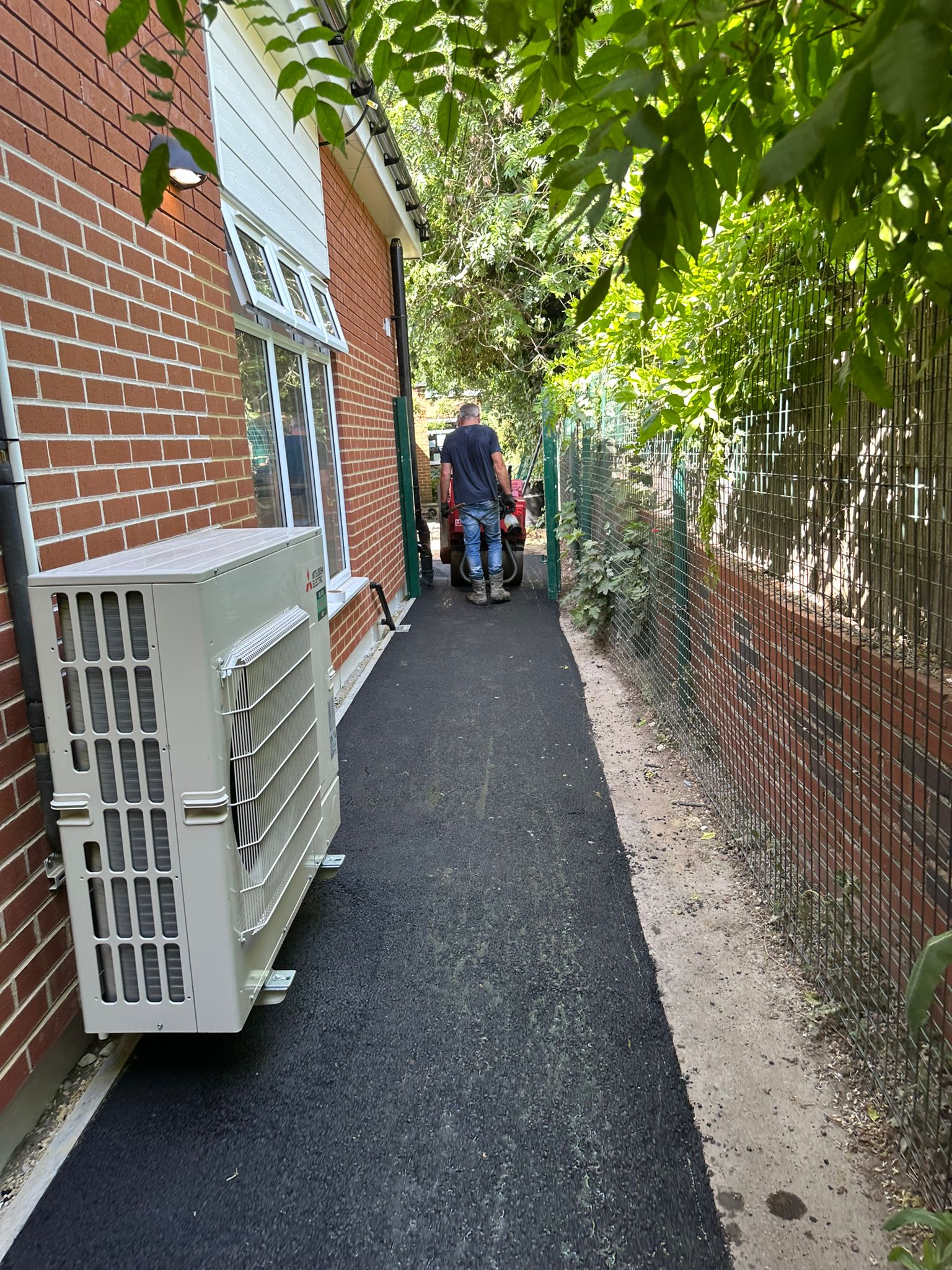 Tarmac path being rolled at school site