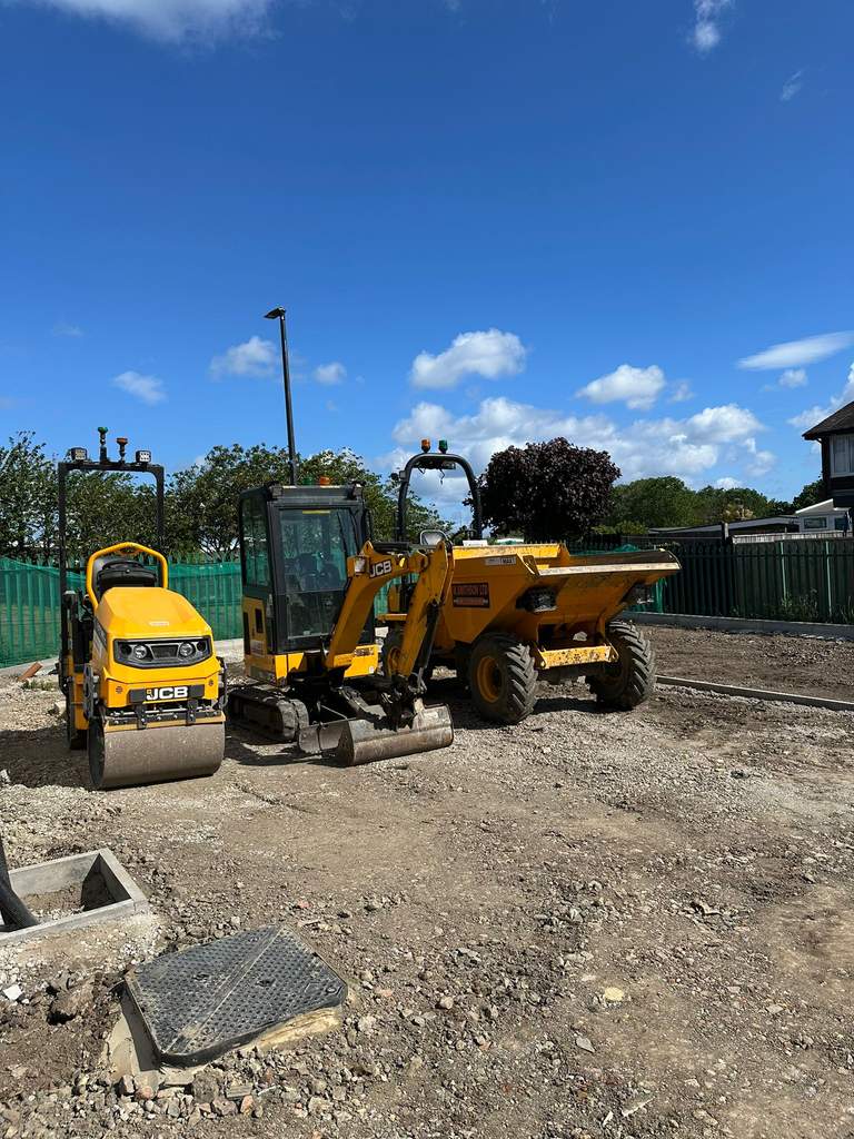 JCB roller mini digger and branded dumper on site at Thanckes Torpoint Cornwall