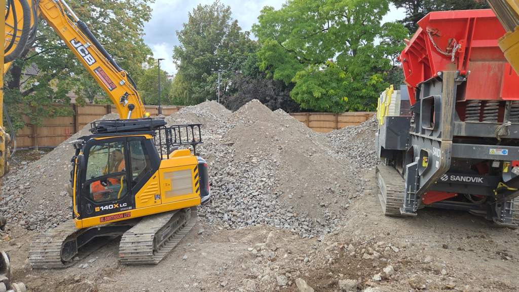 Twin excavators working the deep dig side by side Watford