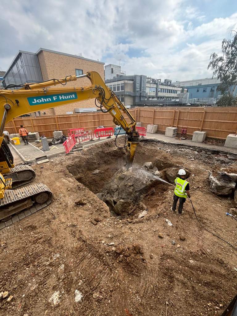 Breaker with dust suppression breaking out buried concrete Watford