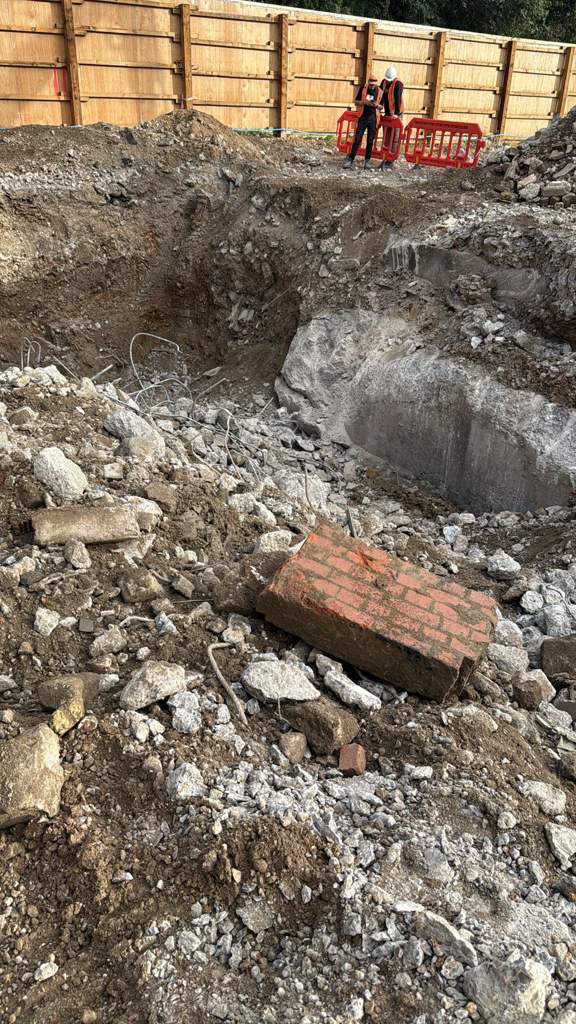 Breaking out mass concrete beside a new kerb line Watford