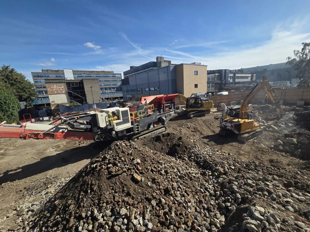 Mobile crusher and excavators processing demolition arisings Watford