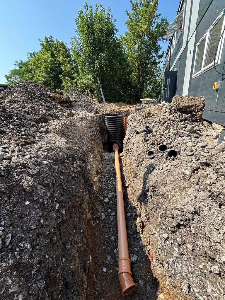 New inspection chamber and pipework bedded in trench